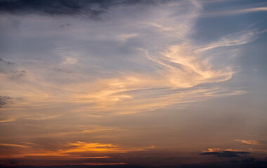Naklejka na ściany i meble Sunset sky with dark clouds