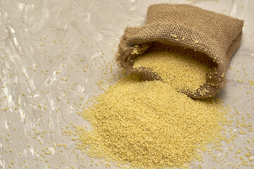 croup couscous poured out of a canvas bag on the table