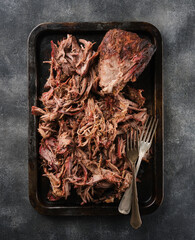 Traditional barbecue pulled pork. Slow cooked pulled pork shoulder. Juicy pork meat cooked in a...
