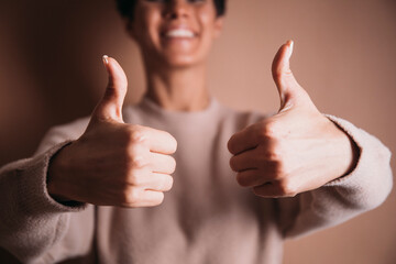 man showing thumbs up. Yes. Ok. Happy day. Celebration. Happy time. Female. 