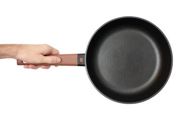 Man is holding an empty black frying pan with a wooden handle. Isolated on a white background. Top view. - obrazy, fototapety, plakaty