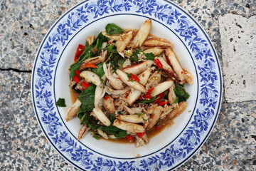 Stir-fried Thai basil with crab meat (Pad Grapow Poo). Stir fried crab with basil in Thai style. Popular Thai food recipe.
