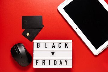 Black friday sale word on lightbox on a red background