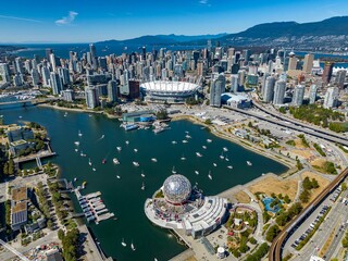 Obraz premium Aerial drone view of the cityscape of Vancouver with modern buildings and Science World museum