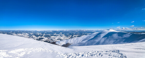 Winter mountains landscape of Carpathians, snow covered hills panorama