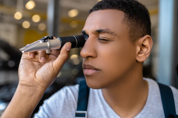 Experienced car technician testing a new auto part