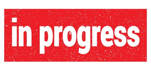in progress text written on red stamp sign.