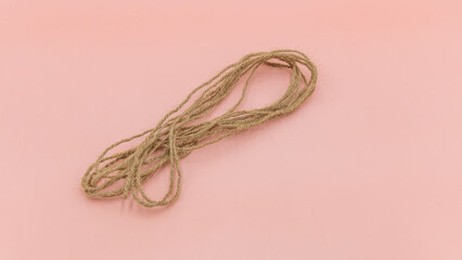 Closeup rope on pink background isolated, Abstract ropes, cables, hems isolated on pink background,