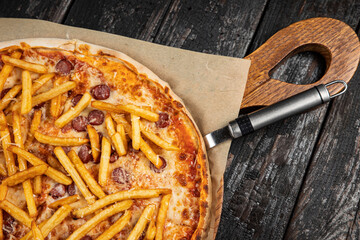 delicious pizza with cheese, greens, sauce in a restaurant
