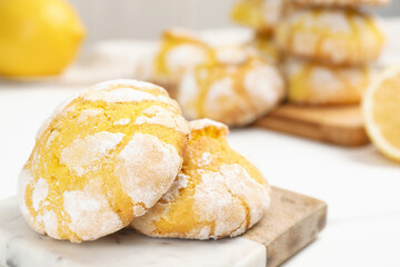 Tasty homemade lemon cookies on white table, closeup. Space for text