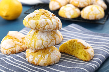 Tasty homemade lemon cookies on blue table, closeup