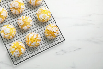 Tasty homemade lemon cookies on white marble table, top view. Space for text