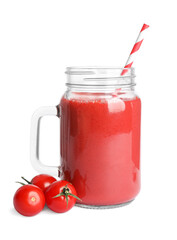 Mason jar of tasty tomato smoothie and fresh vegetables on white background