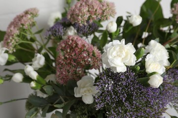 Obraz na płótnie Canvas Bouquet of beautiful flowers on white background, closeup