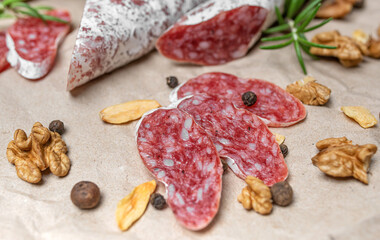 Salami sausage cut into appetizing slices. Delicious snack.