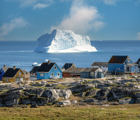 Huge icebergs lining the shores of the charming town of Qeqertarsuaq (formerly Godhavn) on the south coast of Disko Island, Western Greenland. © Luis