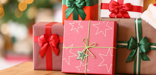Beautiful Christmas gift boxes on table