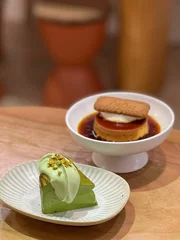 Rolgordijnen Vertical shot of desserts with pistachio and cookies © Ian116/Wirestock Creators