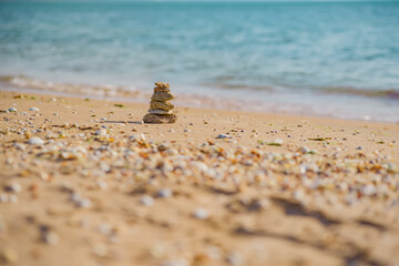 Stones balance on beach, sunrise shot. Zen meditation and relaxation