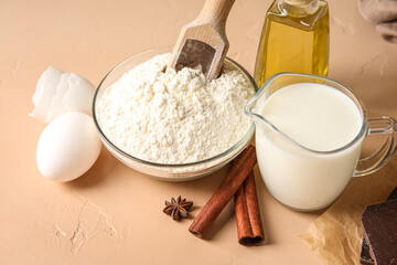 Ingredients for baking on beige table, closeup