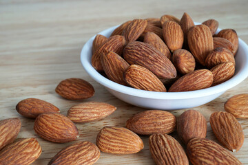 Almonds on wooden table, Healthy organic grains food with high protein
