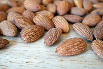 Almonds on wooden table, Healthy organic grains food with high protein