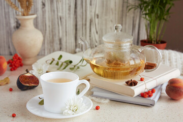 Atmospheric brunch of tea time, herbal tea and figs, peaches. Sweet desserts, natural herbal tea - natural sustainable eco-friendly lifestyle