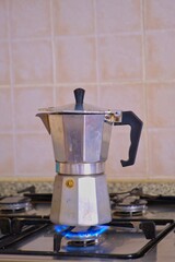 typical italian espresso maker on a gas hob