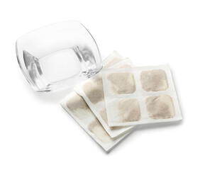 Mustard plasters and bowl of water on white background