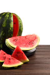 Slices of ripe watermelon on wooden table against white background