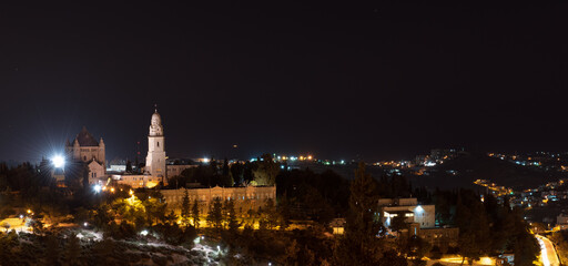 Obraz premium Night view city scape of Jerusalem fortress citadel and landmark cathedral from Israel.