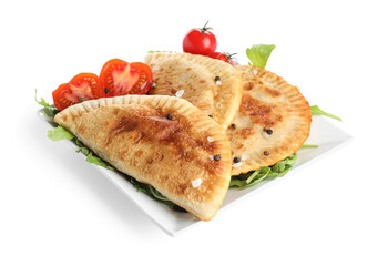 Plate with tasty chebureks and vegetables on white background