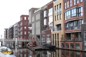 Amsterdam Narva-eiland View with Modern Buildings, Bridge Under Construction and Boats, Netherlands.