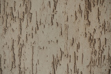 Close view of beige wall with stucco worm finish