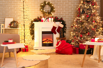 Interior of living room with Santa bag, fireplace and Christmas tree