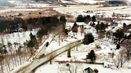 Naklejka premium Bird's eye view of the cityscape of Hillsdale, New York under a cloudy sky in winter