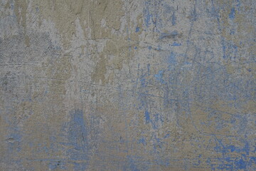 Backdrop - beige and blue old, faded and scratched painted wall