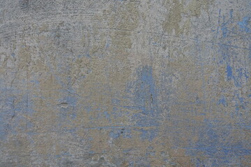 Background - beige and blue old, faded and scratched painted wall