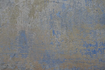 Yellow and blue old, faded and scratched painted wall texture