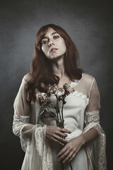 Red hair vampire with dead roses