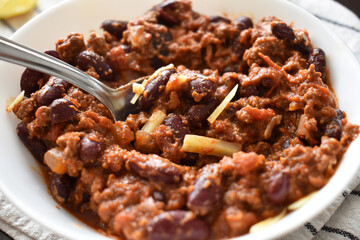 Chilli con carne in a white bowl. Traditional Mexican food.
