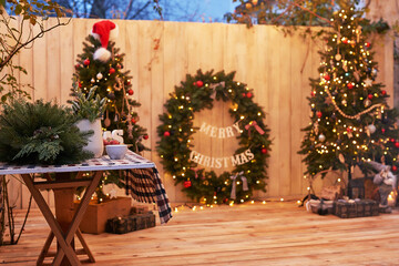 New Year and Christmas backyard decorations. Christmas tree, wreath and gifts