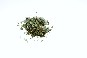 pile of dried melissa herb for dry herb vaporizer isoated against white background