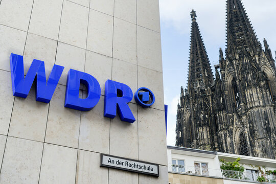 Cologne, Germany, October 03 2022: the wdr logo on the building of the West German Broadcasting Cologne with the cathedral in the background