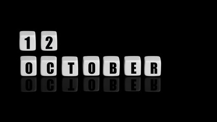 October 12th. Day 12 of month, Calendar date. White cubes with text on black background with reflection. Autumn month, day of year concept