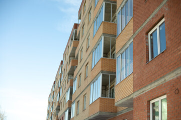 Building is made of brick. New building in city. Wall of house. Brick wall.