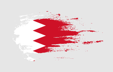 Grunge brush stroke flag of Bahrain with painted brush splatter effect on solid background