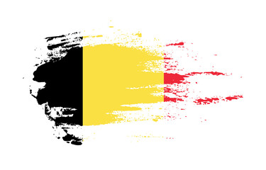 Grunge brush stroke flag of Belgium with painted brush splatter effect on solid background