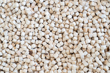 A plenty of small wooden cubes are full filled in a kid playground area for the child's background.