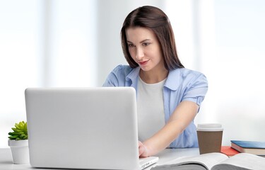 Young business woman work on computer at office